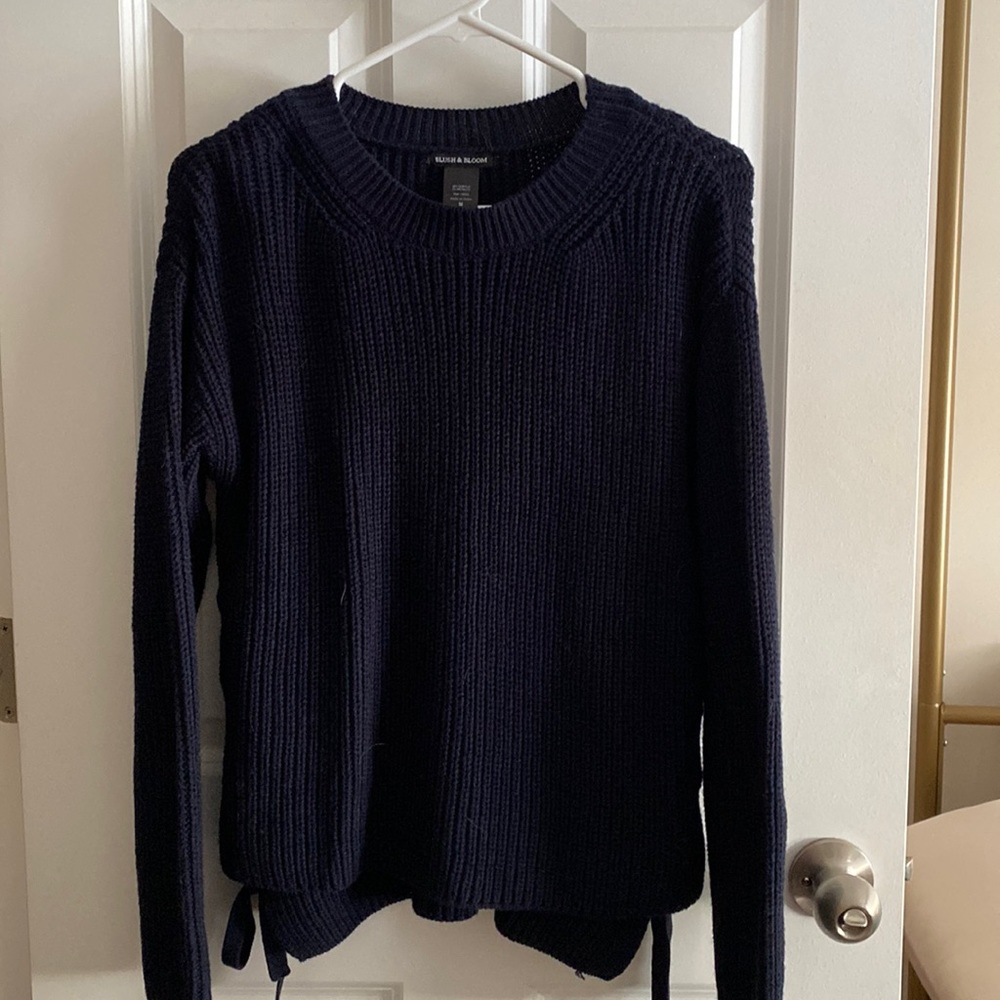 Navy Blue knit sweater with side lace up detail.